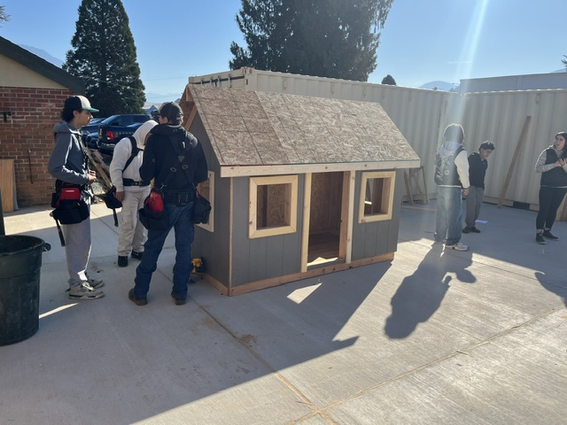 Students building a playhouse